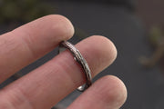 tree branch ring on the tip of womans finger for scale