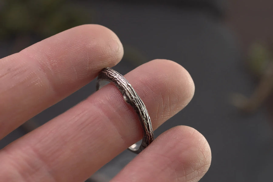 tree branch ring on the tip of womans finger for scale
