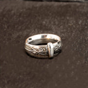 sterling silver blade in bow styled band with leaf & vine details