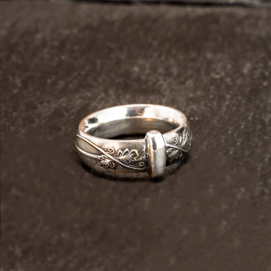sterling silver blade in bow styled band with leaf & vine details