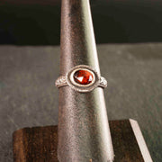 sterling silver filigree and garnet ring, aptly named "the great queen". Vintage styling, hammered texture and a rosecut bezel set garnet