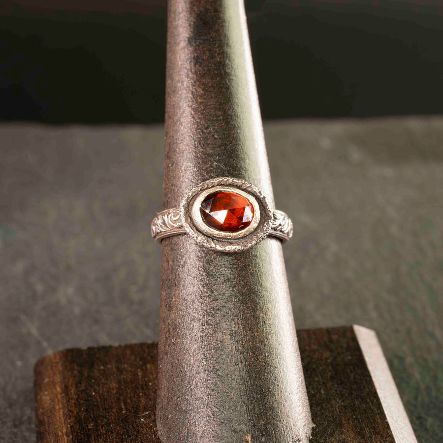 sterling silver filigree and garnet ring, aptly named "the great queen". Vintage styling, hammered texture and a rosecut bezel set garnet