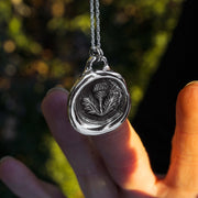 thistle heirloom pendant for scotland lovers. The necklace is on a polished rope chain