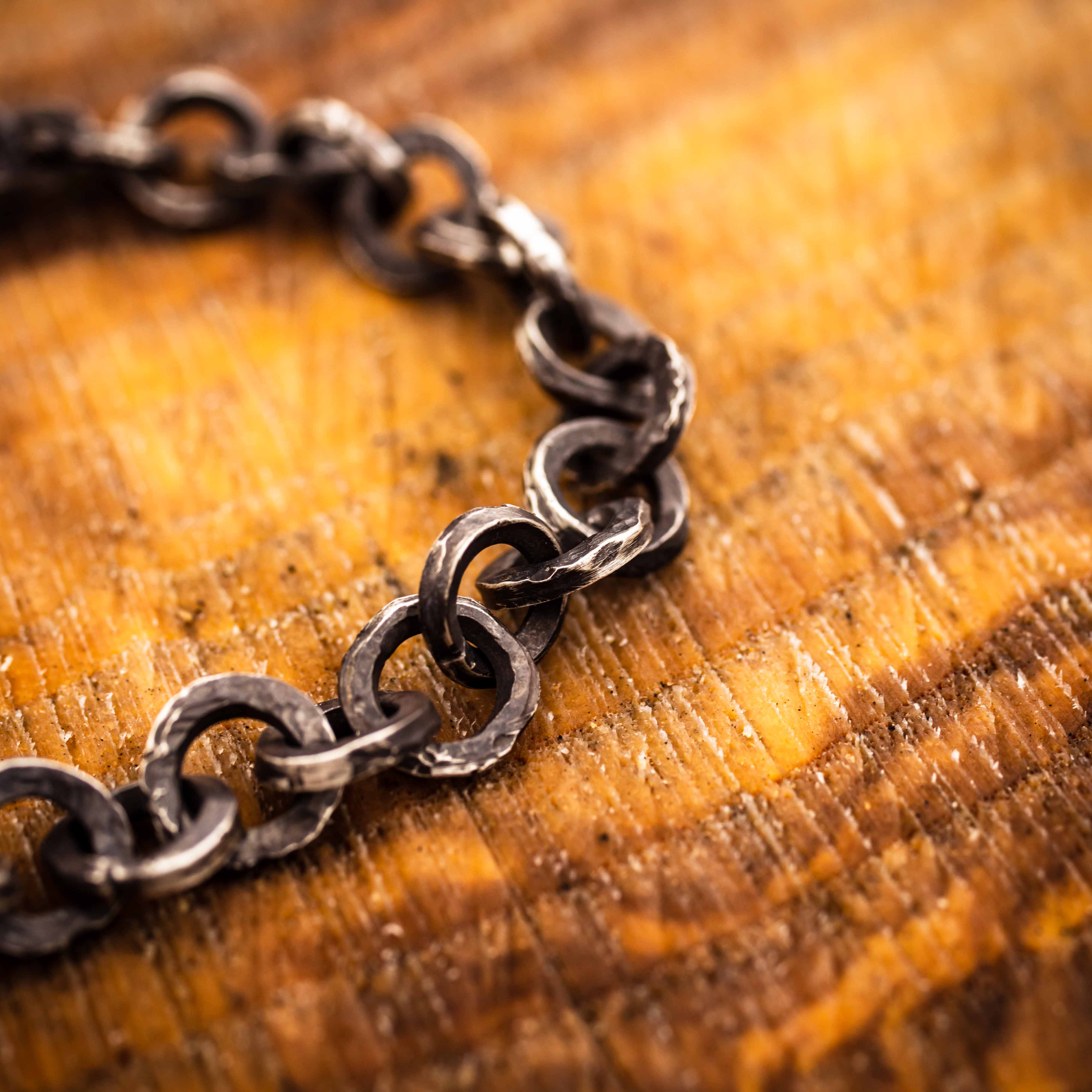 Round darkened chain link bracelet, made in a brutalist style for men or women. Sterling Silver