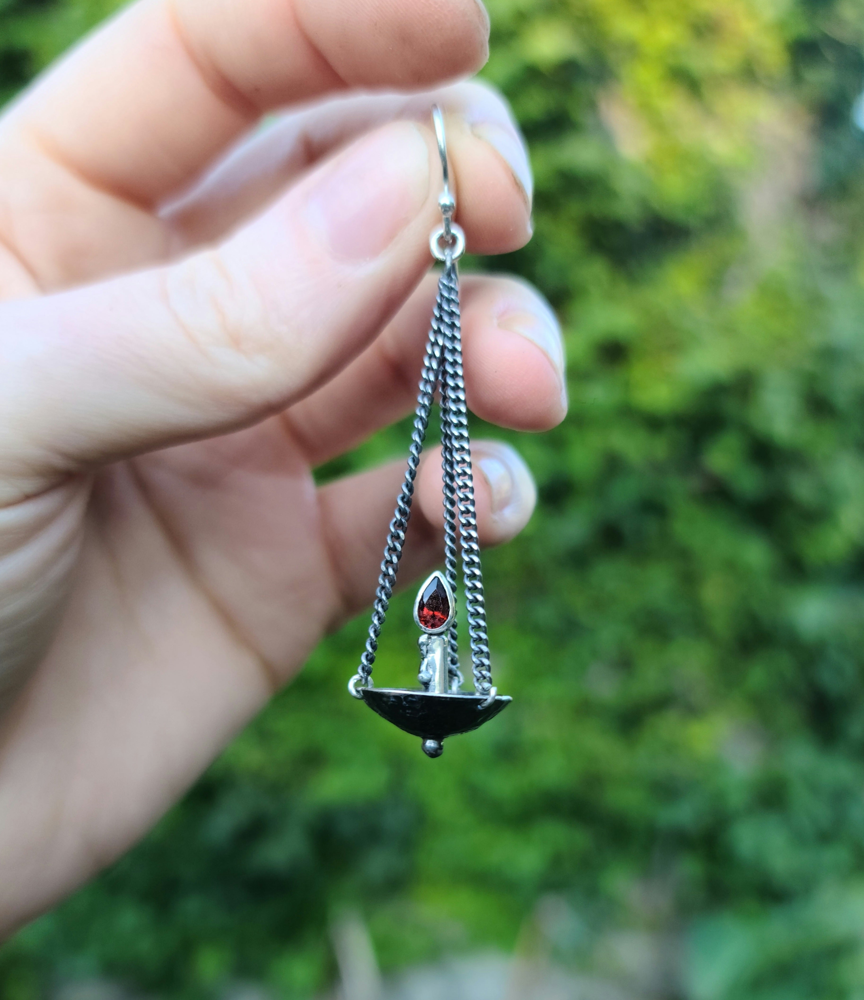 The flames of Justice- dangling argentium silver candle earrings with garnets