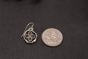 ekklesia dangle earrings next to a US quarter for scale