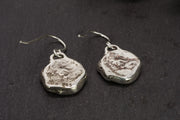 the textured backside of our sterling silver ekklesia earrings