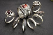 a group of gothic and nature inspired rings