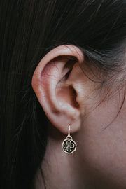 gothic cathedral inspired earrings in womans ear