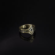 10K yellow Gold ring with a focal center star on a black background