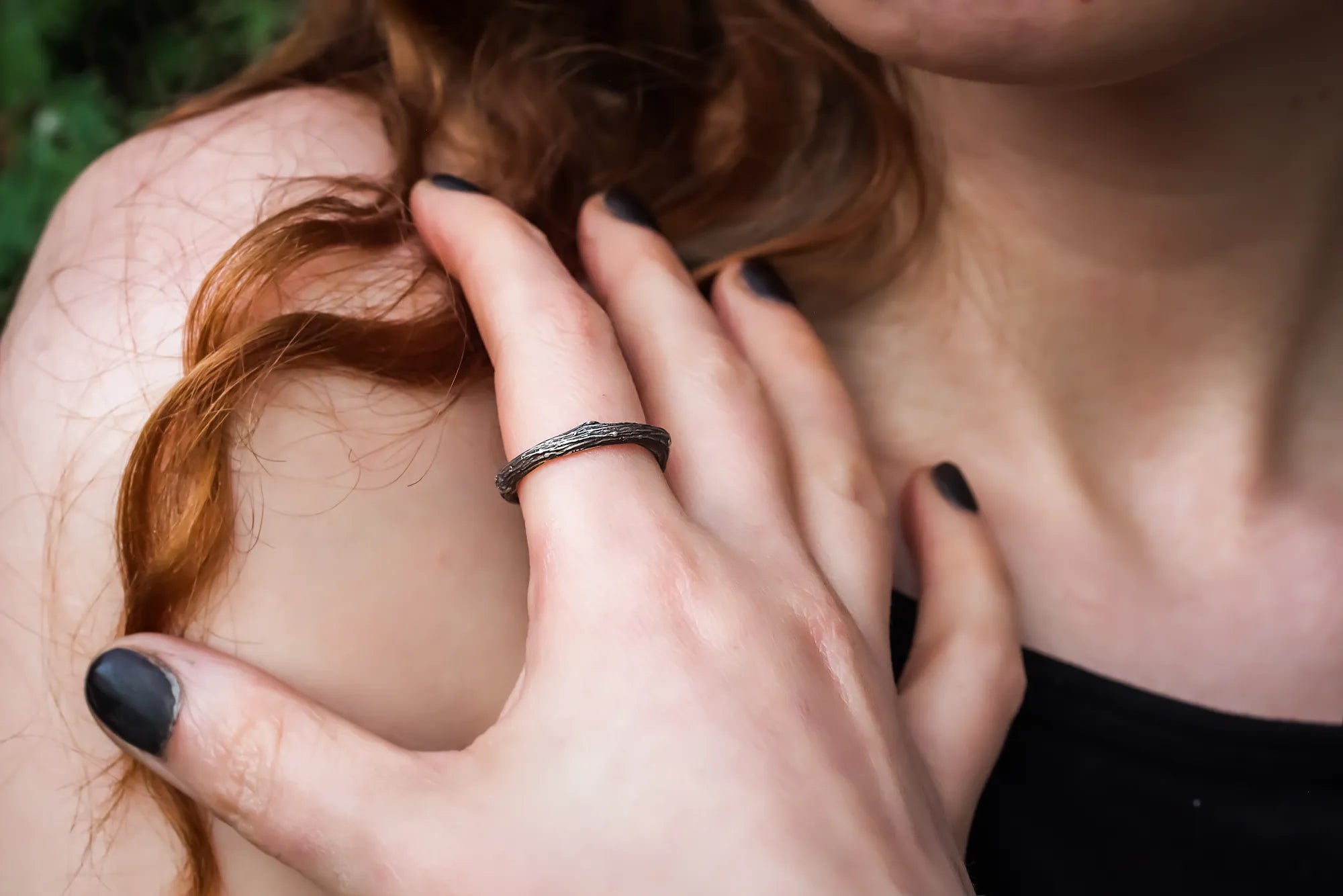 sterkling silver branch ring worn on womans finger
