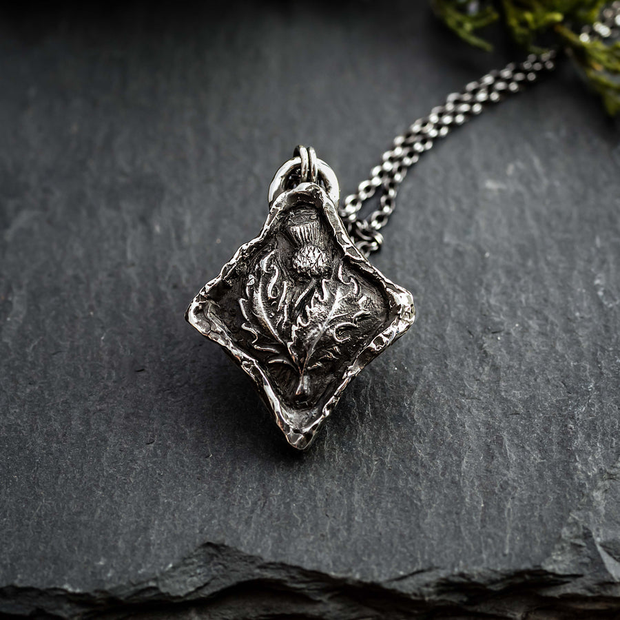 Diamond shaped thistle pendant with organic texture. The necklace is made from sterling silver and arrives on your choice of chain length & style.