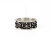 a head on shot of the thistle and highland interlace ring. the ring features hammered details at the top, and a thistle linking the knot work details